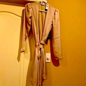 Beautiful champagne wrap dress. Never worn. Falls above knee.